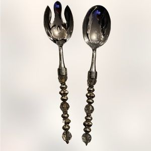 2 saints 10 inch decorative serving utensils unused
